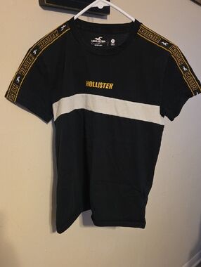 Hollister Black Tee with White Stripe and Yellow Logo Trim